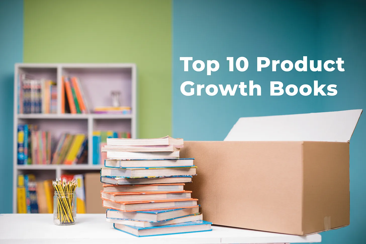 Title card reading "Top 10 Product Growth Books" in white type on a teal wall, above a leaning stack of paperbacks, a jar of pencils and an open cardboard box on a white desk, with a blurred bookshelf behind.