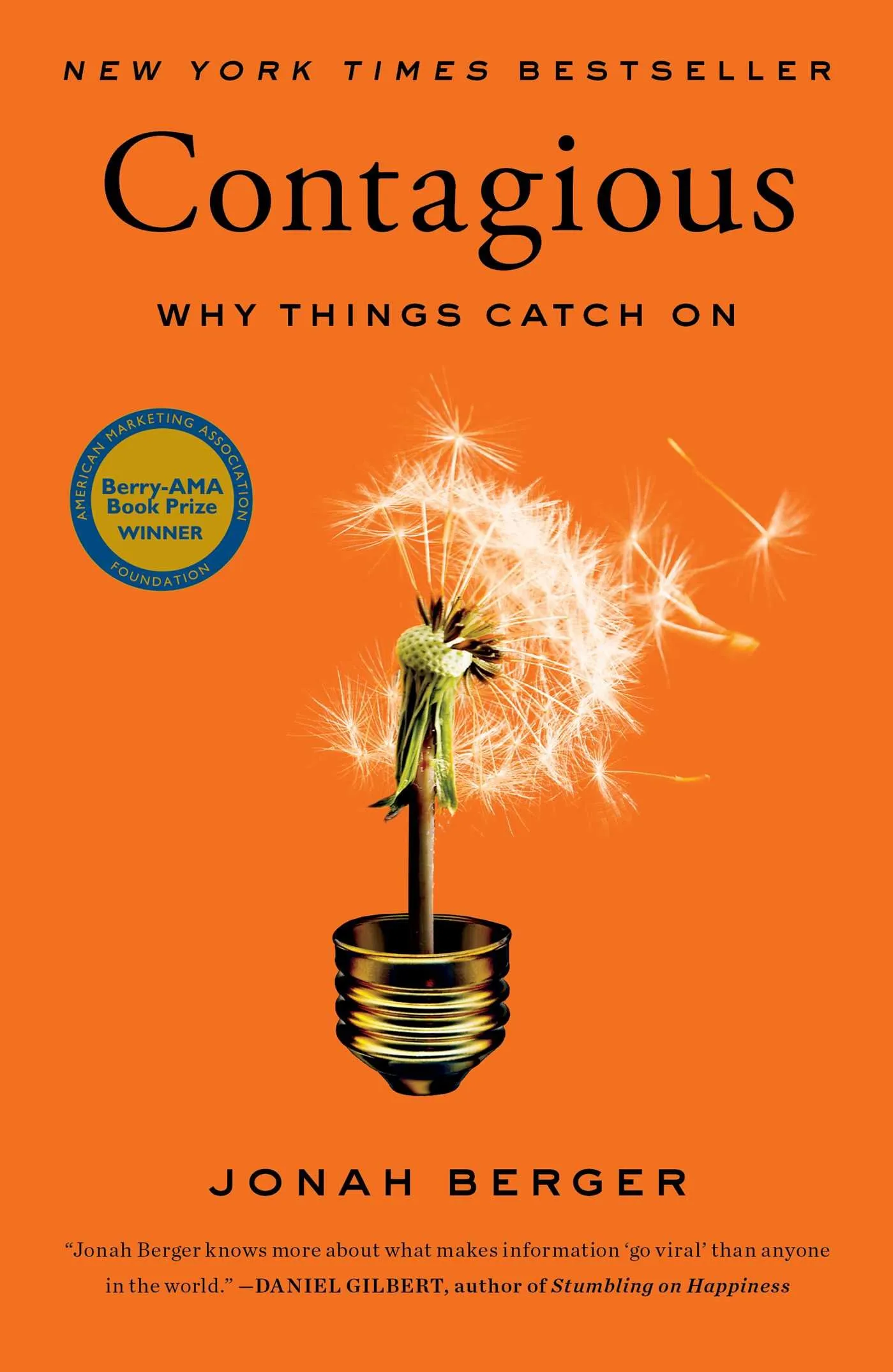 Orange cover of Contagious by Jonah Berger, subtitled "Why Things Catch On", showing a dandelion clock seeding out of a lightbulb socket. It is marked a New York Times bestseller and a Berry-AMA Book Prize winner, and quotes Daniel Gilbert: "Jonah Berger knows more about what makes information go viral than anyone in the world".